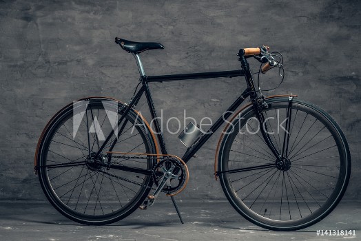 Picture of An authentic vintage single speed bicycle over grey background